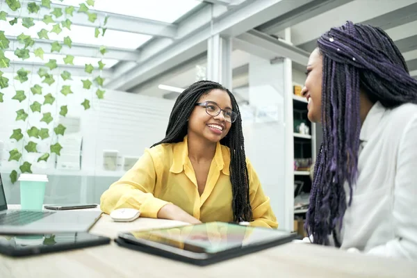 Ladies talking in an office