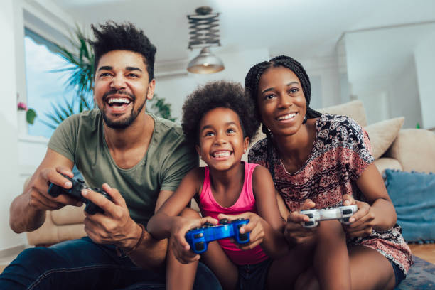 Family having fun while playing video games